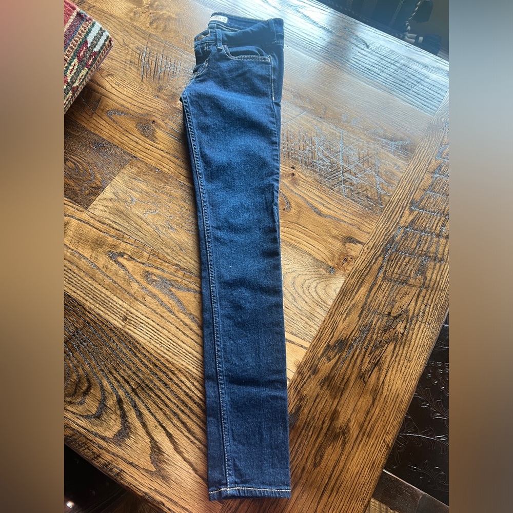 Two pairs of jeans for teens.